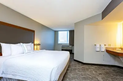 a hotel room with a large bed and a window at SpringHill Suites by Marriott Miami Airport South Blue Lagoon Area in Miami