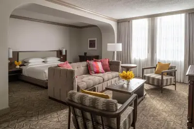 a hotel room with a couch and a bed at Hyatt Regency Coral Gables in Miami in Miami