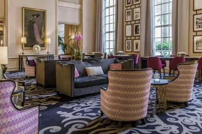 a lobby with a couch and chairs and tables at Hyatt Regency Coral Gables in Miami in Miami