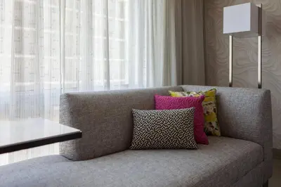 a couch with pillows on it in a living room at Miami Airport Marriott in Miami