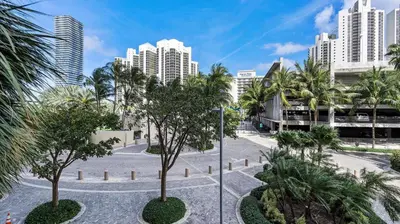 a park in the middle of a city with tall buildings at Family getaway in Sunny Isles - 2nd floor in Miami Beach