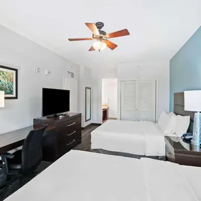 a hotel room with two beds and a ceiling fan at Homewood Suites by Hilton Fort Lauderdale Airport-Cruise Port in Dania Beach