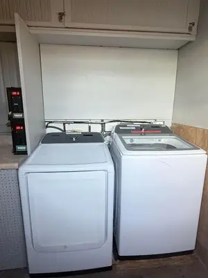 two refrigerators sitting next to each other in a refrigerator at Sheridan Guesthouse in Dania Beach