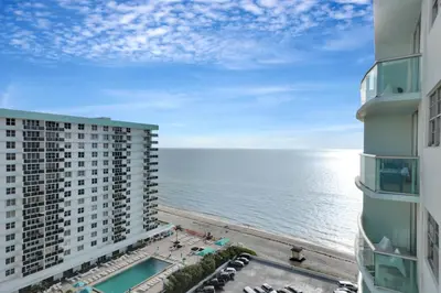 a view of the beach from the balcony of a building at THE TIDES 1bedroom apt 15th floor WE ARE ON THE BEACH! in Hollywood