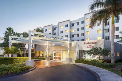 an exterior view of a hotel with a building at Residence Inn by Marriott Miami Airport in Miami