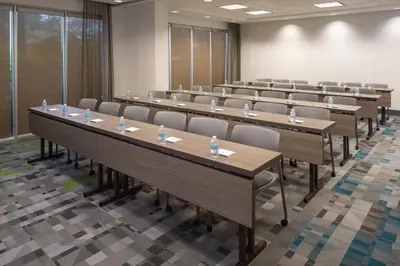 a large room with rows of tables and chairs at SpringHill Suites Miami Downtown/Medical Center in Miami