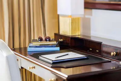 a desk with a pen and some books on it at Trump National Doral Golf Resort in Miami