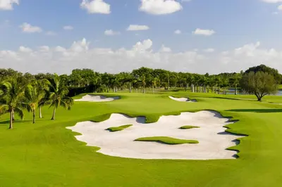 an aerial view of a golf course with palm trees at Trump National Doral Golf Resort in Miami