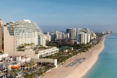 an aerial view of a beach with buildings and the ocean at The Ritz-Carlton, Fort Lauderdale in Fort Lauderdale