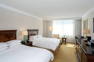 a hotel room with two beds and a television at JW Marriott Miami in Miami