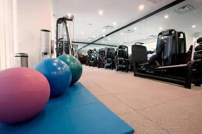a gym with pilates balls and exercise machines at Miami Marriott Dadeland in Miami