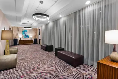 a waiting area in a hotel lobby with a waiting room at Courtyard Miami Downtown Brickell Area in Miami