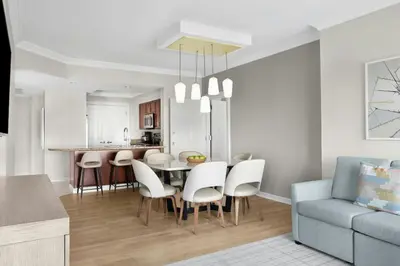 a kitchen and dining room with a table and chairs at Marriott's BeachPlace Towers in Fort Lauderdale