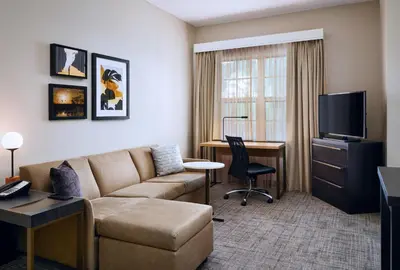 a living room with a couch and a desk at Residence Inn Fort Lauderdale SW/Miramar in Miramar