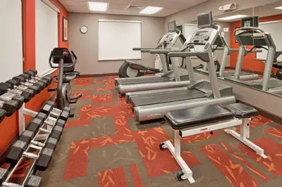 a gym with treadmills and ellipticals at Residence Inn by Marriott Fort Lauderdale City of Plantation in Plantation