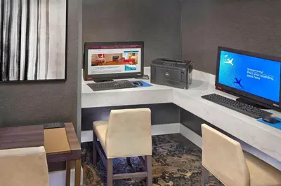 an office with a desk with two computers on it at Residence Inn by Marriott Fort Lauderdale Weston in Weston