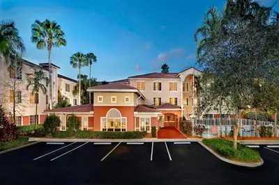 a large house with a parking lot at Residence Inn by Marriott Fort Lauderdale Weston in Weston