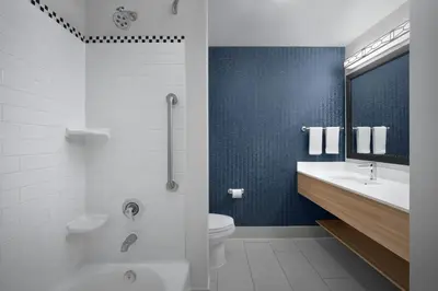 a bathroom with a toilet and a tub and a sink at Fairfield Inn & Suites Fort Lauderdale Airport & Cruise Port in Dania Beach