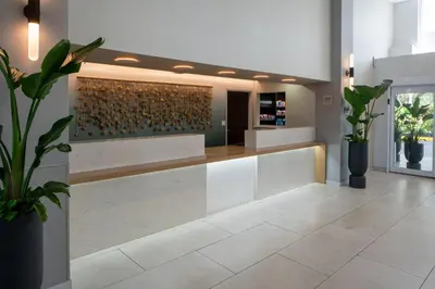 a lobby with a wall of wine bottles at SpringHill Suites Fort Lauderdale Airport in Dania Beach