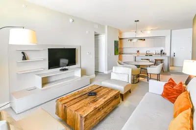 a living room with a couch and a table at Luxurious Hyde Resort Apartments in Hollywood