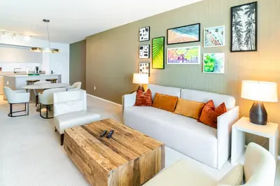 a living room with a couch and a table at Luxurious Hyde Resort Apartments in Hollywood
