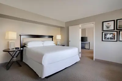 a large white bed in a hotel room at Sheraton Suites Fort Lauderdale West in Plantation