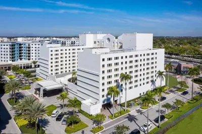 an aerial view of a large white building at Sheraton Suites Fort Lauderdale West in Plantation
