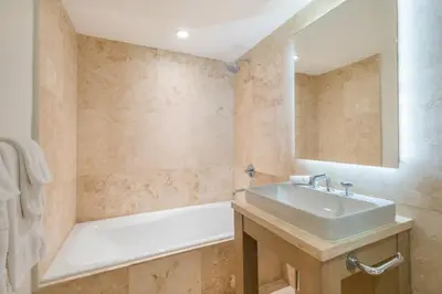 a bathroom with a sink and a bath tub at Oceanview Private Condo at 1 Hotel & Homes -1144 in Miami Beach
