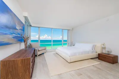 a bedroom with a bed and a large window at Oceanfront Private Condo at 1 Hotel & Homes -1019 in Miami Beach