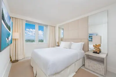 a white bedroom with a large bed and a window at Luxurious Private Condo at 1 Hotel & Homes -1445 in Miami Beach