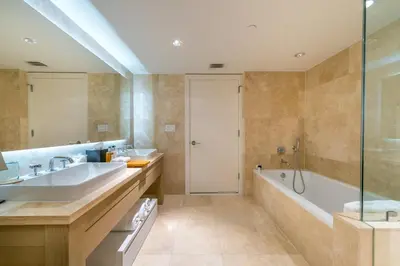 a bathroom with two sinks and a tub and a shower at Luxurious Private Condo at 1 Hotel & Homes -1445 in Miami Beach