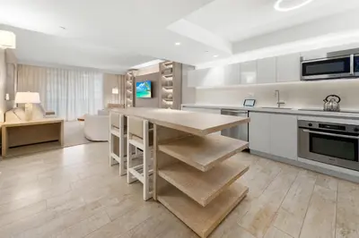 a kitchen with a wooden island in a room at Oceanview Private Condo at 1 Hotel & Homes -1211 in Miami Beach