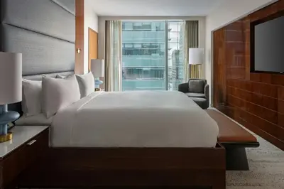 a hotel room with a large bed and a television at JW Marriott Marquis Miami in Miami