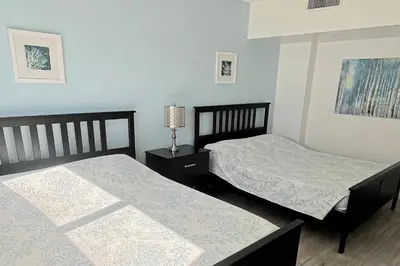 two beds in a room with blue walls at THE TIDES 2 bedrooms 9th floor WE ARE ON THE BEACH! in Hollywood