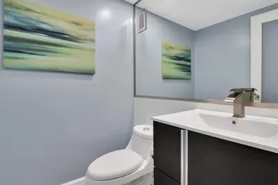 a bathroom with a white toilet and a sink at THE TIDES 2 bedrooms 9th floor WE ARE ON THE BEACH! in Hollywood