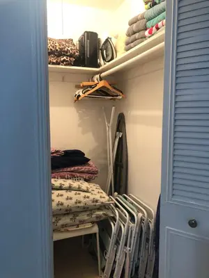 a walk in closet with racks of clothes at Hollywood Beachfront House in Hollywood