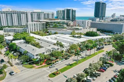 an aerial view of a city with buildings and a street at Tradewinds Apartment Hotel Miami Beach in Miami Beach