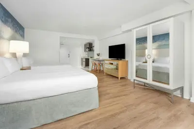 a hotel room with a bed and a desk at Marriott Vacation Club, South Beach in Miami Beach