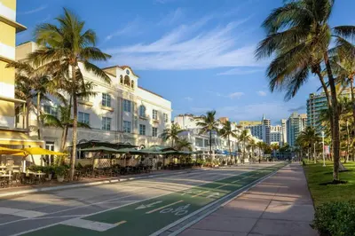a street in the city with palm trees and buildings at Marriott Vacation Club, South Beach in Miami Beach