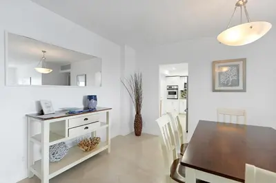 a kitchen and dining room with a table and chairs at 2 BEDROOMS 2 FULL BATHROOMS APT. ON THE BEACH in Hollywood