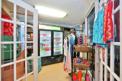 a store aisle with clothes in a store at Hollywood Beach Tower in Hollywood