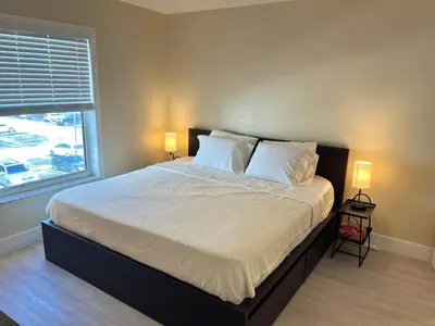 a bedroom with a bed with two pillows and a window at King condo Fort Lauderdale Central beach in Fort Lauderdale