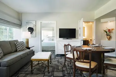 a living room with a couch and a table at Hilton Grand Vacations Club Mcalpin Ocean Plaza Miami in Miami Beach