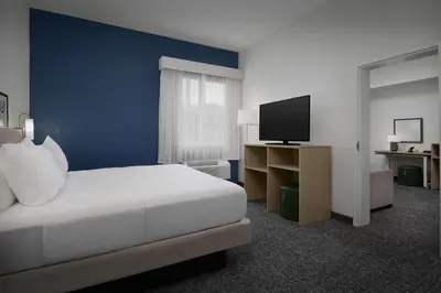 a hotel room with a bed and a television at Spark by Hilton Miami Doral in Miami