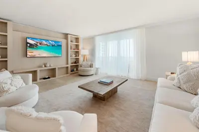 a living room with a white couch and a coffee table at Oceanview Private Condo at 1 Hotel & Homes -1122 in Miami Beach