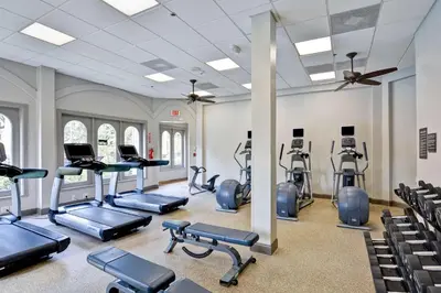 a gym with treadmills and exercise equipment in a building at Embassy Suites by Hilton Miami International Airport in Miami