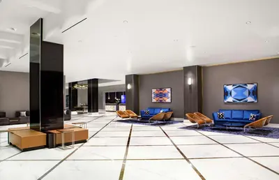 a lobby of a hotel with couches and chairs at Hilton Miami Downtown in Miami