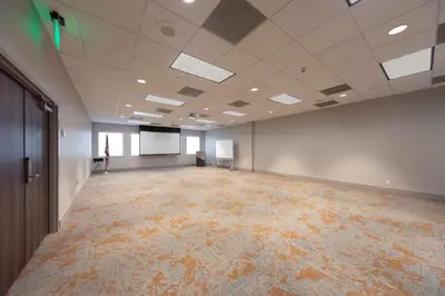 an empty room with a large room with a large room at Hampton Inn & Suites Miami Airport South/Blue Lagoon in Miami