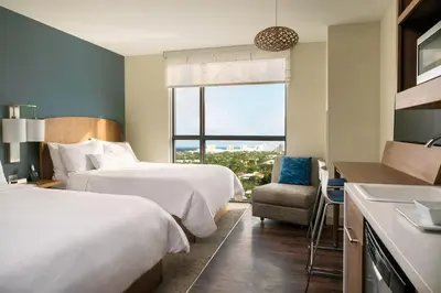 a hotel room with two beds and a window at Element Fort Lauderdale Downtown in Fort Lauderdale