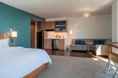 a hotel room with a bed and a kitchen at Element Fort Lauderdale Downtown in Fort Lauderdale